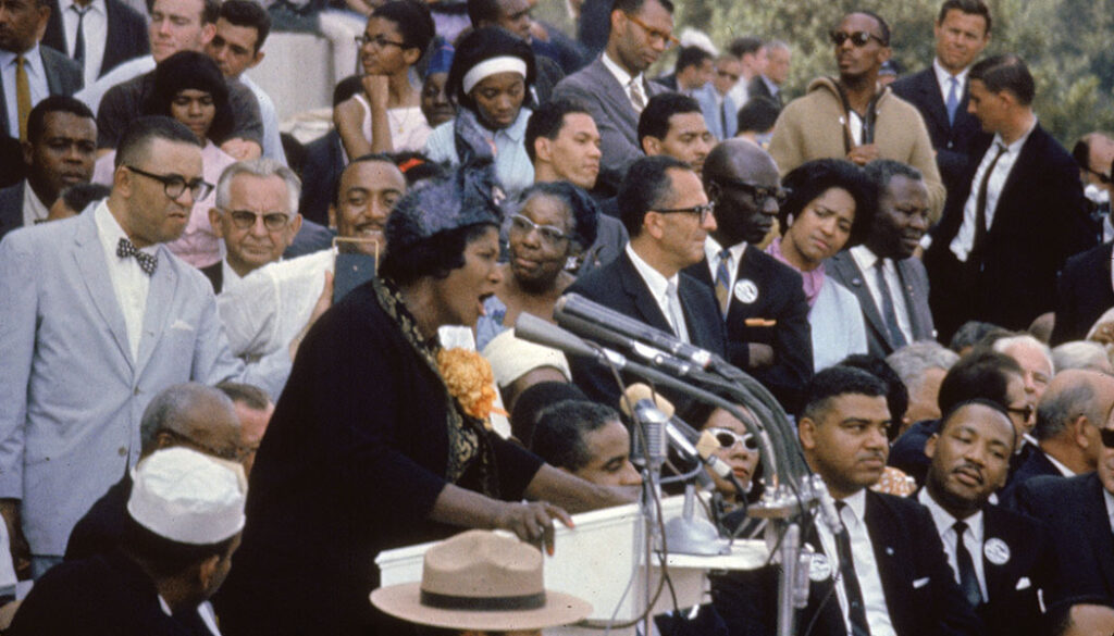 Mahalia Jackson and the Reverend Martin Luther King, Jr. on the steps of the Lincoln Memorial in Washington, D.C.