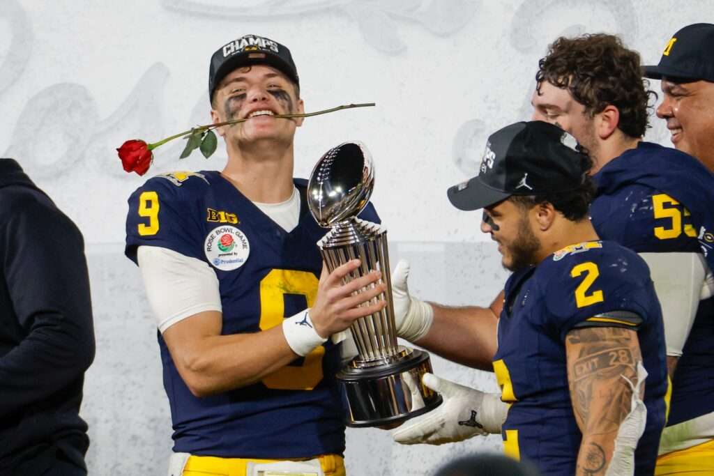 Michigan quarterback J.J. McCarthy #9 celebrates with trophy after defeating Alabama during the 2024 Rose Bowl game Monday, Jan. 1, 2024, in Pasadena, Calif.