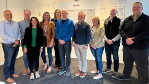 SpartanNash CEO Tony Sarsam and members of the executive leadership team (ELT) with author and business management consultant Jim Collins in Boulder, Colorado